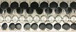 Hanging teflon pans and lids on wall