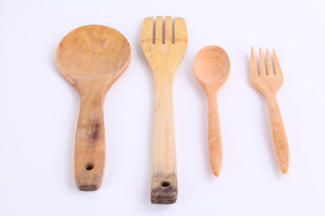 Wall Mural - wooden kitchen utensil, spoon and fork on white background