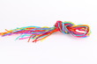 © Suwit - Colorful paper rope with knot isolated on white .