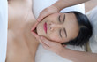 © Stock_ko - A beautiful woman slept with eyes and massage the face and head at the spa.