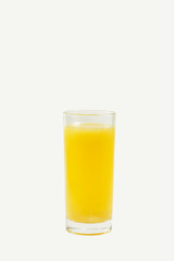 A glass of orange juice isolated on a white background.