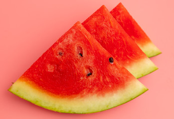 Canvas Print - Ripe red watermelon isolated on a pink background.