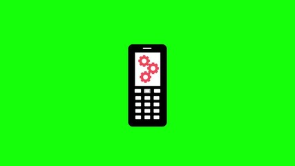 Animation of gears rotation on the screen of a black push-button telephone on a green background