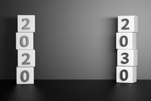 Two Stacks Of Cubes With 2020 And 2030 Year Numbers. Mockup With Copy Blank Space Future Forecast Prediction.