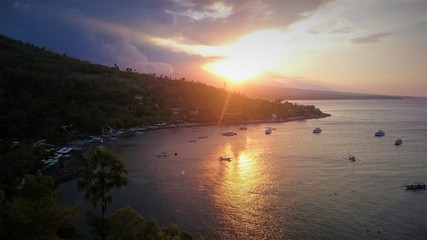 Beautiful Sunset in the bay of Amed, vulcano sea sun beach Bali, Indonesia