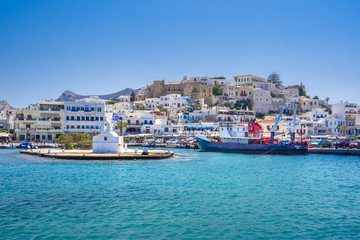 Chora of Naxos island as seen from the famous landmark the Portara with the natural stone walkway towards the village, Cyclades, Greece.