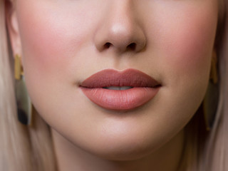 Sexual full lips. Natural gloss of lips and woman's skin. The mouth is closed. Increase in lips, cosmetology. Natural lips. Great summer mood with open eyes. fashion jewelry. Pink lip gloss