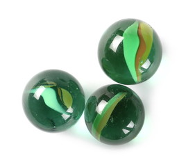 Green glass marbles, isolated on white background, top view