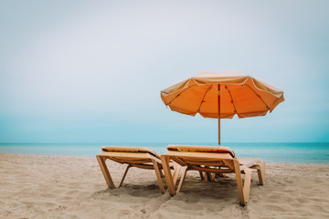 Wall Mural - Beach chairs on tropical vacation, travel to sea concept