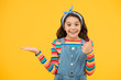 © be free - old fashioned kid fashion. little beauty handkerchief long hair. vintage style. happy childhood. retro girl cheerful gesture. summer vacation joy. little child yellow background. presenting product
