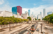 View Of Chicago Downtown Skyline With Railroad Yard Under Bridge, USA