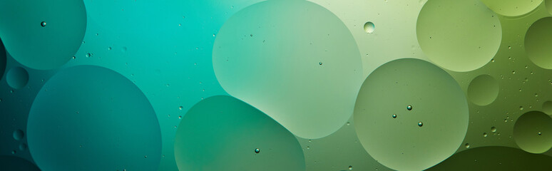 panoramic shot of Beautiful abstract background from mixed water and oil in turquoise and green color