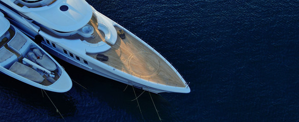 Wall Mural - Aerial drone ultra wide photo of luxury yacht with wooden deck docked in tropical exotic destination