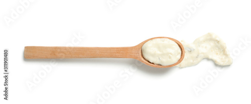 Fotografía Wooden spoon with sauce isolated on white background