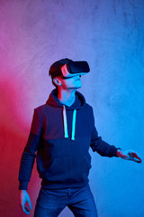 Young man using virtual reality helmet