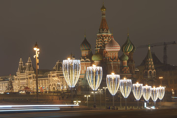 Sticker - Bright illuminated Red Square, facade of the Saint Basil's Cathedral in Moscow. Lighting and decoration of the Red Square during winter night.