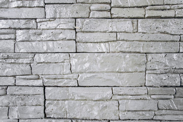 The texture of the brick wall is gray. Brick background