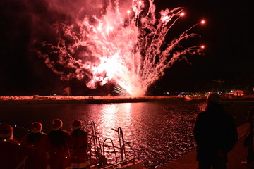 Wall Mural - Fireworks to celebrate the arrival of Santa Claus by boat