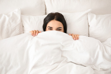 Poster - Young woman awakening at home, top view. Lazy morning