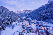 Aerial night view of the Val Gardena ski resort mountain village in Dolomites, Italy, Beautiful cozy village in winter time during Christmas.