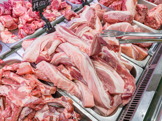 Wall Mural - Pile of raw pork chop meat at butchers shop