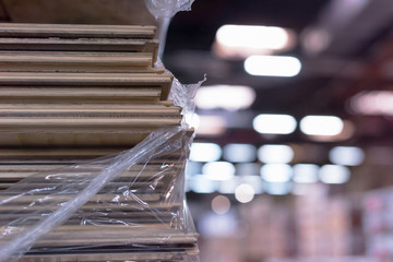 Wall Mural - Timber Flooring Factory. Pile of cut wood in factory storage warehouse. Lumber in warehouse.