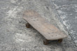 old wooden Skateboard on the cement road