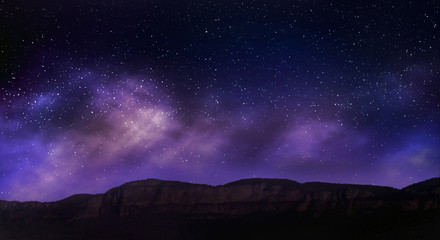 Wall Mural - night sky stars on mountains background.