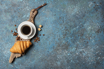 Wall Mural - Appetizing crispy croissant and coffee for tasty breakfast