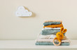 © lithiumphoto - Organic cotton baby clothes on the shelf in the kids room