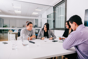 Wall Mural - Group of office workers at a meeting around the boss