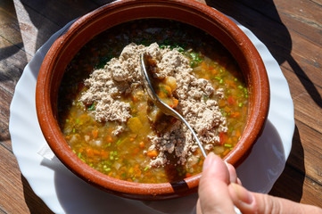 Homemade vegetables soup served with Canarian gofio flour based on local recipe of Masca village, Tenerife, Spain