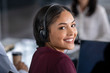 © Rido - Woman wearing headset in call center