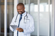 © Rido - African doctor using digital tablet at hospital