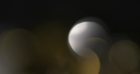 Wall Mural - Abstract bokeh light  background for overlay.  Real Lens flare light effect. Sparkle ray leak on black background. 