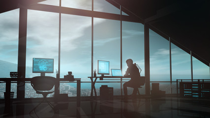 Male web developer works at a computer in his office.