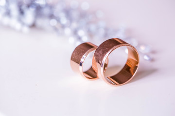 Gold wedding rings with bride decorations in the interior. Winter style 