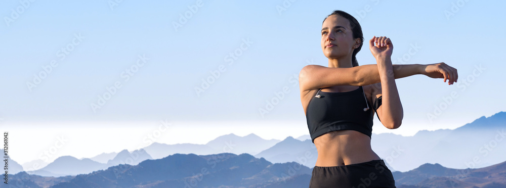 A young slim athletic girl in sportswear with snakeskin prints performs a set of exercises. Fitness and healthy lifestyle.	 - obrazy, fototapety, plakaty 