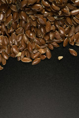 Poster - Brown Flax seed. Also known as Linseed, Flaxseed and Common Flax. Closeup of grains, background use.