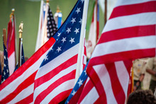 Multiple American Flags Are Part Of A Patriotic Celebration.