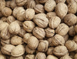 Walnuts for sale at market or supermarket. Background image of organic, vegan or vegetarian raw food. 