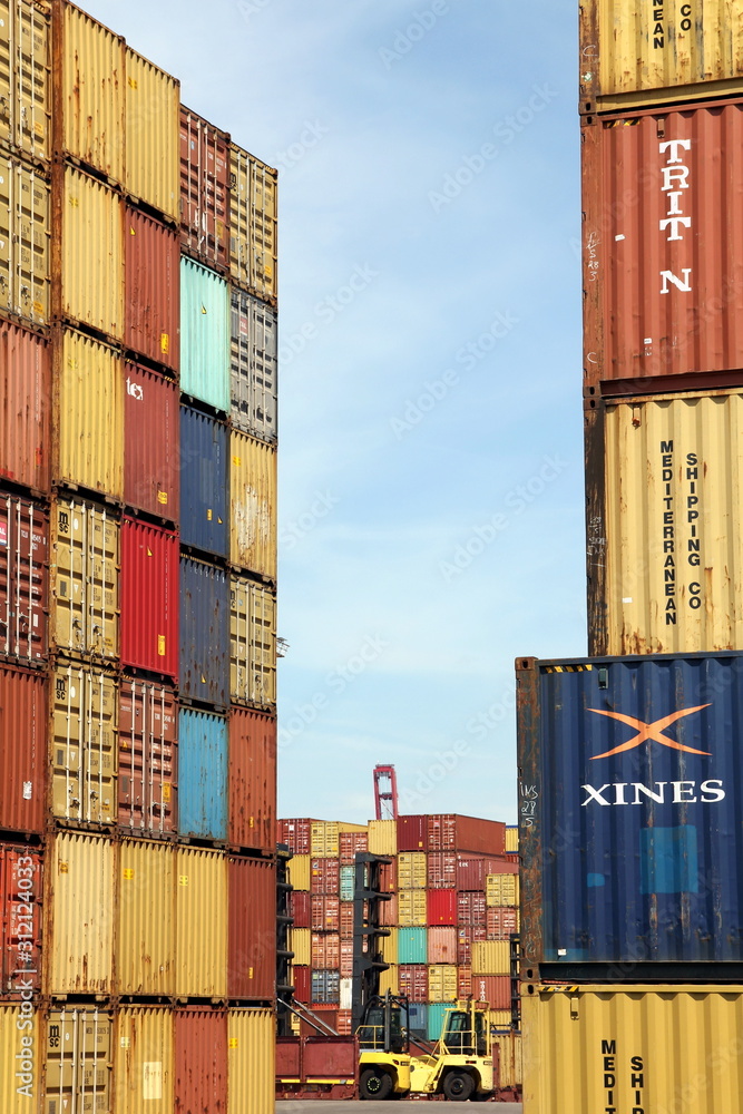 HAMBURG, GERMANY - JUNE 2, 2019: Stacked Shipping Containers and Empty ...