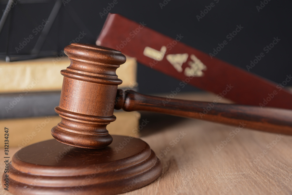 Judge's gavel and law books on table