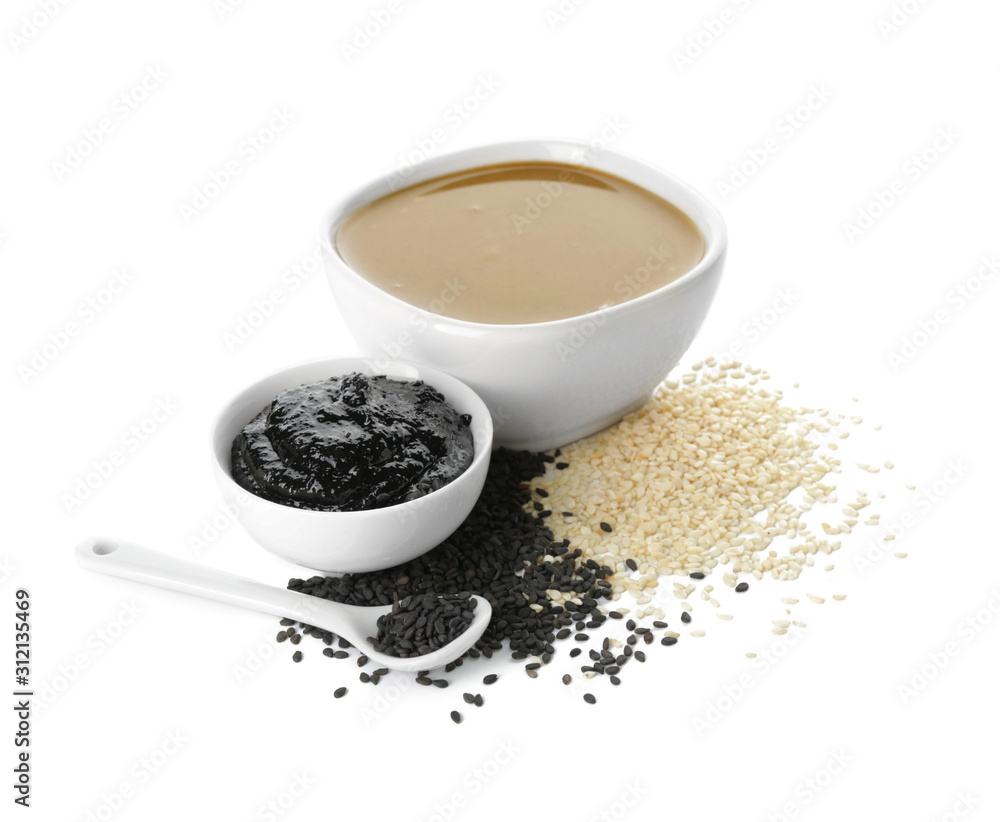 Bowls of tasty tahini on white background
