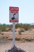 Caution Rattlesnake Sign In The Desert