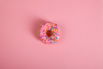 Wall Mural - colorful doughnuts pink background studio