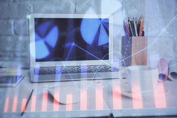 Forex Chart hologram on table with computer background. Double exposure. Concept of financial markets.