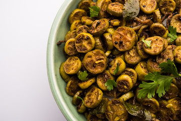 Wall Mural - Tendli / Kundroo sabzi or Kovakkai Poriyal also known as ivy gourd, served in a bowl or karahi. selective focus