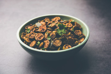 Wall Mural - Tendli / Kundroo sabzi or Kovakkai Poriyal also known as ivy gourd, served in a bowl or karahi. selective focus