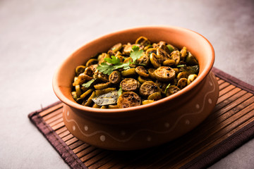 Wall Mural - Tendli / Kundroo sabzi or Kovakkai Poriyal also known as ivy gourd, served in a bowl or karahi. selective focus